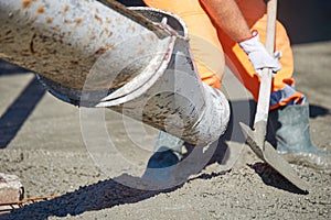 Concrete pouring during commercial concreting floors of building