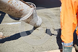 Concrete pouring during commercial concreting floors of building