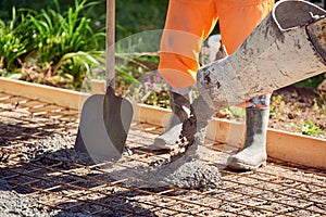 Concrete pouring during commercial concreting floors of building