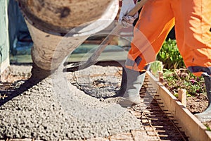 Concrete pouring during commercial concreting floors of building