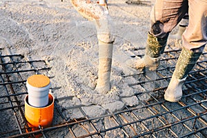 Concrete pouring during commercial concreting floors of building