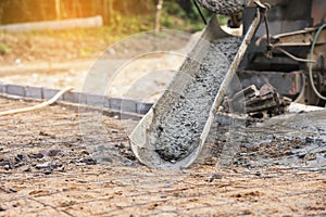 Concrete pouring during commercial concreting floors of building