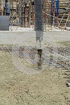 Concrete pouring during commercial concreting floors of buildings in construction site and Civil Engineer,