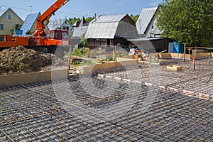 Concrete pump in anticipation of pouring concrete in a prepared