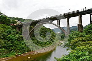 Concrete railway bridge across the river in Houtong