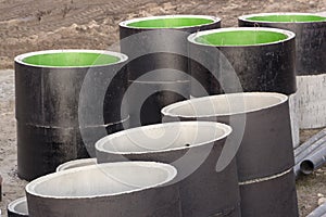 Concrete rings and pipes covering bitumen for sewerage