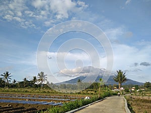 Concrete road leading to the village at the foot of the Sumbing Mountain