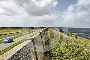 Concrete sea wall on a dike photo