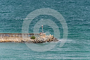 Concrete seawall and a beacon. Black Sea coast in Golden Sands