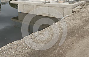 concrete shoring on the river bank