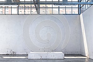 Concrete Showcase In Enlightened White Hangar, Empty Factory Interior or Warehouse With Concrete Floor.