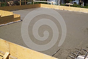 concrete slab of foundation with wooden formwork