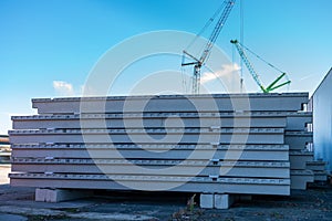 Concrete slabs stacked on construction sites.