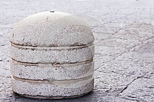 Concrete spheres prohibiting parking barrier on the street in Catania, Sicily, Italy