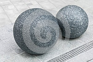 Installation of concrete spheres on the sidewalk