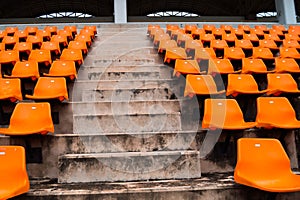 Concrete stair and orange seat in stadium