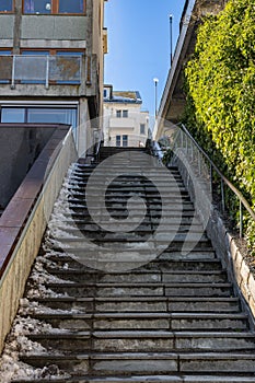 Concrete staircase leading up the side of a modern multistory apartment building, Kristiansund