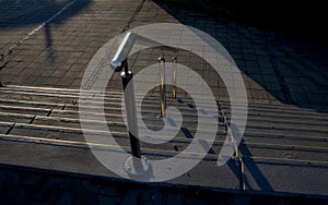 concrete staircase with stainless steel polished tubular railing.