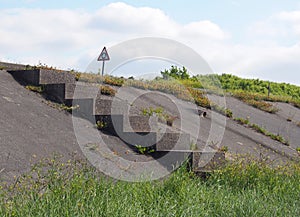 Concrete staircase surrounded by grass leading to a coastal road along the ribble estuary near southport merseyside with a