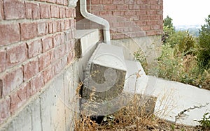 Concrete Stairs falling away from home due to earth settling