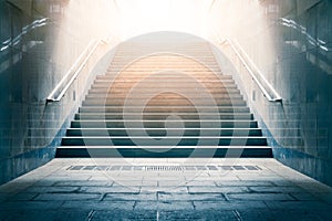 Concrete stairs leading up towards light. Concept of hope and bright future.
