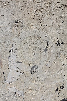 Concrete stone wall background. Stone surface, a fragment of an old wall. Grunge texture close up.