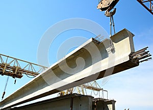 The concrete structure raise the crane on blue sky background