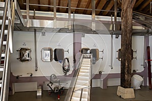 Concrete tanks for first fermentation of grapes, Bordeaux Saint-Emilion wine making region picking, sorting with hands and