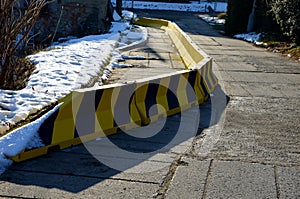Concrete temporary traffic signs. highway concrete barriers on the road. when part of road slides down, the traffic is led into on