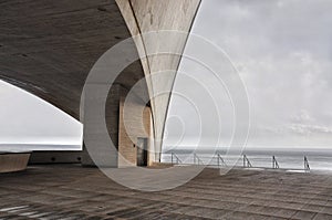 Concrete terrace with misterious industrial Atlantic Ocean view photo