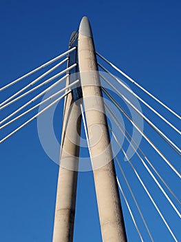 The concrete tower and cables of the suspension bridge in southport merseyside against a blue sky