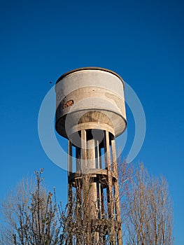 Concrete tower with water cistern.