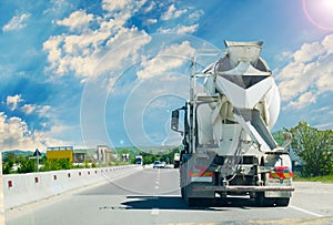 Concrete truck mixer on construction in trafic