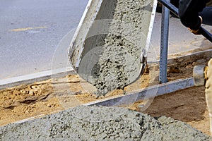 Concrete truck with pouring cement during to residential street