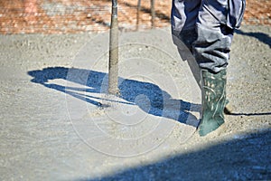 Concrete Vibrator being used on a construction site photo