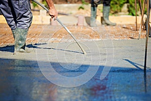 Concrete Vibrator being used on a construction site photo