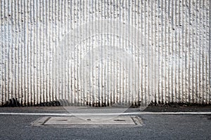 Concrete wall and asphaltic road