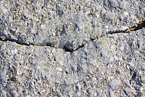 Concrete wall background with a deep crack