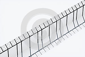 Concrete wall with barbed wire against blue sky. Concept border, prisons, refugees, loneliness. 3D illustration, 3D render, copy