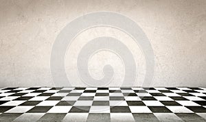 Concrete wall and checkerboard floor photo