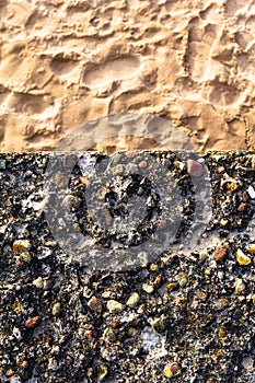 Concrete wall colorful pebbles sand