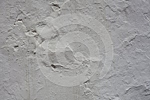 concrete wall with cracked plaster