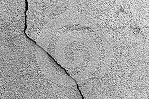 Concrete wall with cracks.