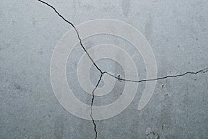 Concrete wall with cracks and scratches. abstract gray background with patterns. wall is ready for renovation