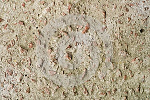 Concrete wall with granite pebbles.