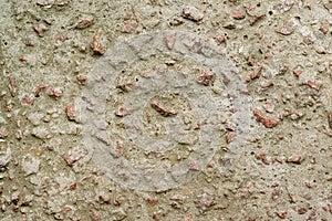 Concrete wall with granite pebbles.