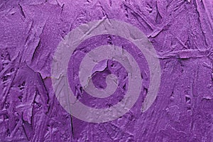 Concrete wall, Old flaky paint on surface, purple color, texture. Abstract background