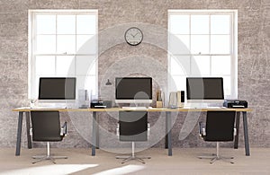 Concrete wall open space office interior with a wooden floor, a blank wall and a row of computer desks along the wall. 3d renderin