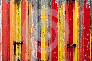 Concrete wall with red, yellow and orange vertically stripes