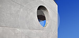 Concrete wall with a round window